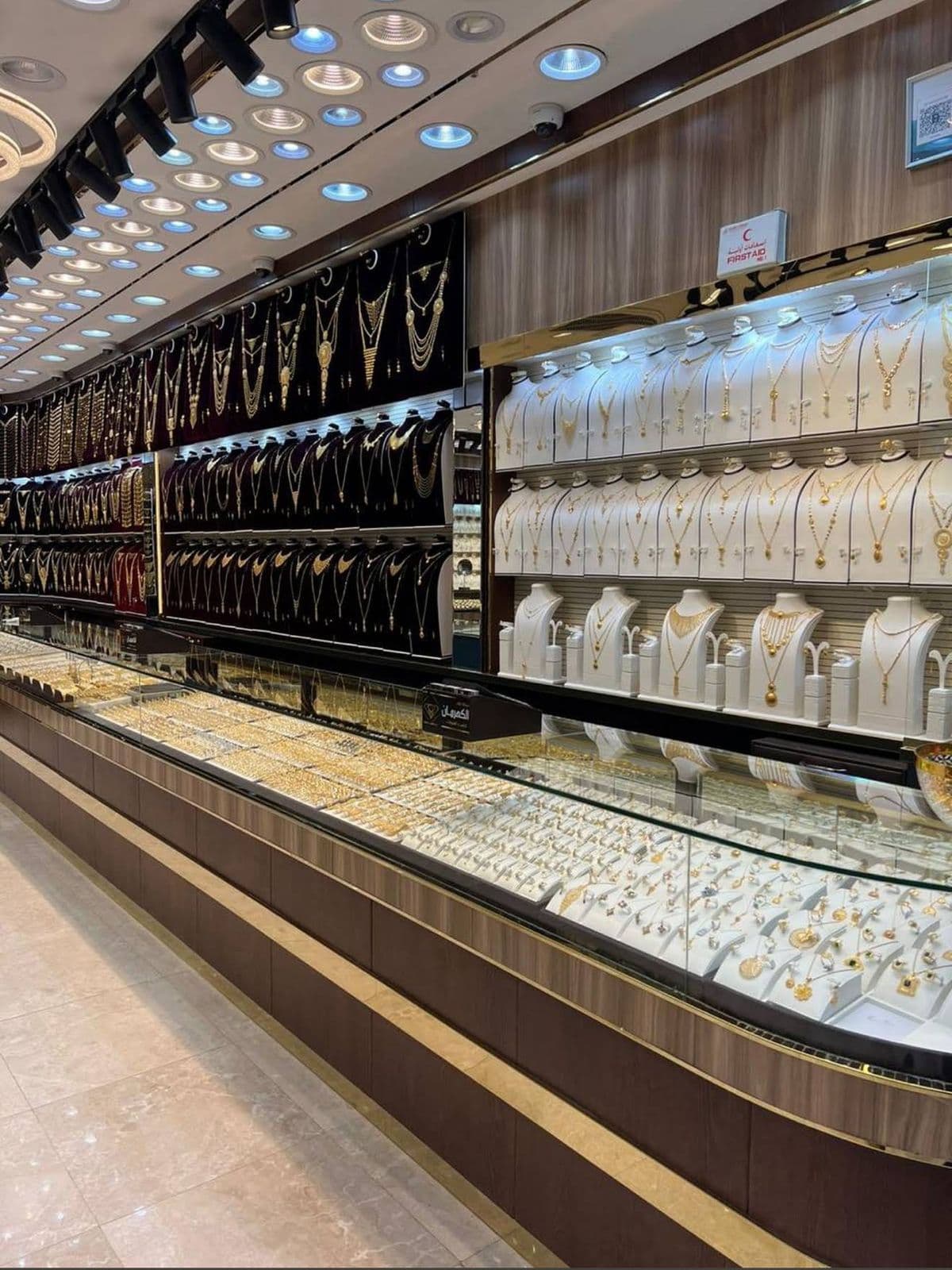 Gold shop retail interior with display wall and lit counters